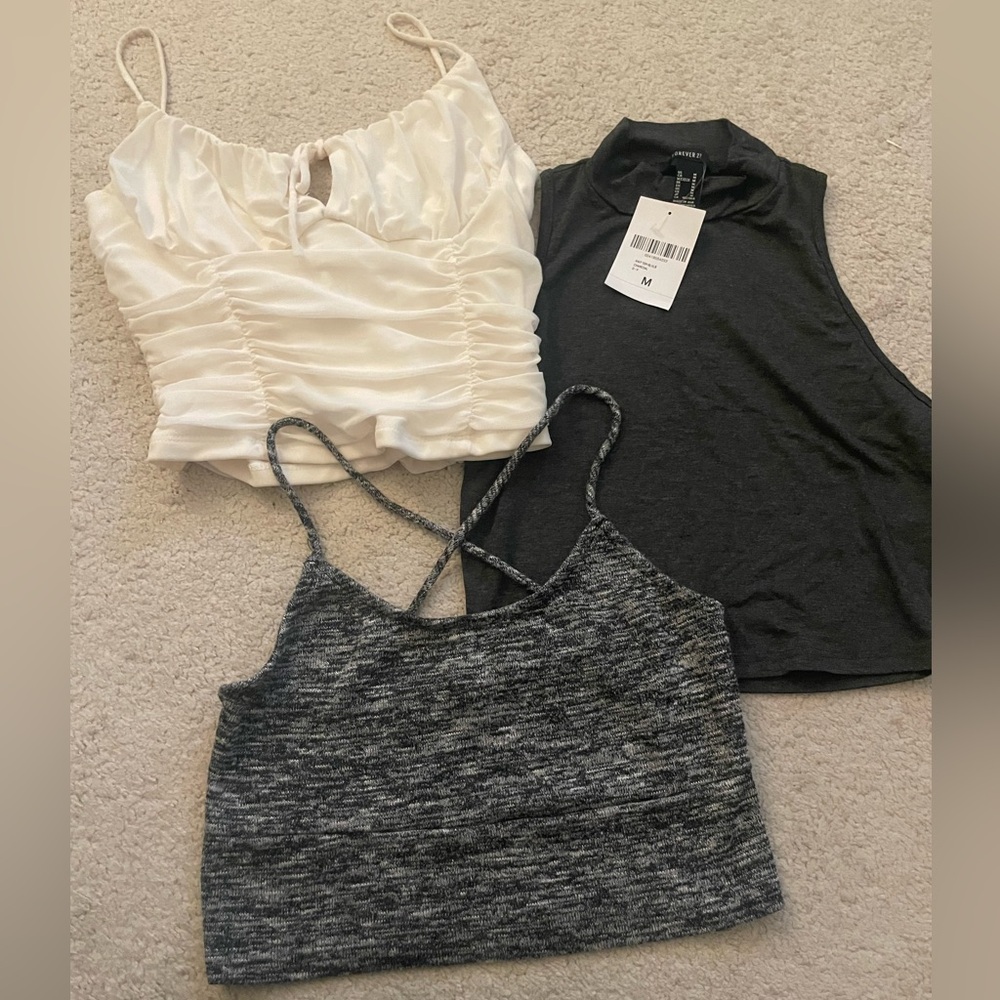 3 for 1 crop top sale! White tank, grey halter, and grey tank with cross back